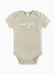 100% Organic cotton infant bodysuit in our Sweet Pea print. Tykes Corner uses certified organic baby clothing so Moms can feel at ease knowing our clothing is free of harmful chemicals and dyes. Sized 0-3, 3-6, 6-12, 12-18 months. Machine wash cold / Tumble Dry Low Remember to support small on your baby registry! Copy and paste the link or click on the Etsy icon in your Babylist app and search Tykes Corner. Need a gift set? You will be a hit at the baby shower!! https://www.etsy.com/shop/tykesco Basic Cotton Onesie For Spring, Spring Organic Cotton Fitted Bodysuit, Organic Cotton Fitted Bodysuit For Loungewear, Fitted Short Sleeve Organic Cotton Bodysuit For Summer, Fitted Organic Cotton Short Sleeve Onesie, Fitted Organic Cotton Bodysuit With Short Sleeves, Fitted Organic Cotton Short Sleeve Bodysuit, Soft Fitted Cotton Onesie, Fitted Short Sleeve Bodysuit In Organic Cotton For Summer