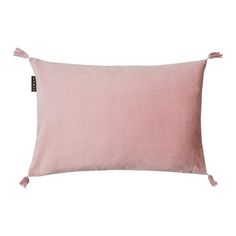 a pink pillow with tasselled edges and a black button on the front side