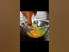 a person is mixing eggs in a bowl