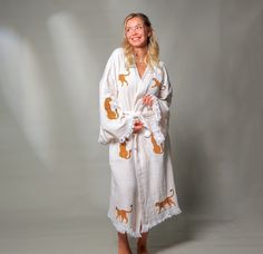 "Model Height : 5′ 2 (160cm) Stay trendy and comfortable with the Tiger Kaftan Kimono. Made from 100% organic cotton and hand-printed with the Tiger  design, this Greek goddess-style kaftan is the perfect cover-up for all your summer needs.  Whether you're spending the day at the beach, picnicing in the park, or just lounging at home, the lightweight, breathable fabric will keep you cool and comfortable. This eco-friendly and quick-drying kimono is an excellent choice for summer activities. Features *100% Cotton  *Soft, Light & Fluffy *An adjustable waist belt secures the robe from the front. Size: Length: 47\" - 120cm     Width: 33.5\" - 85 cm Care *Machine wash cold at a gentle cycle. *No bleach. *Iron on the reverse side Please do not hesitate to reach out to us with any questions. Than White Cotton Kimono For Fall, Cotton Kimono For Loungewear In Fall, Cotton Kimono With Printed Design And Relaxed Fit, Cotton Kimono For Fall Loungewear, Cotton Kimono With Relaxed Fit And Printed Design, Printed Cotton Kimono With Relaxed Fit, White Cotton Kimono With Relaxed Fit, Beige Cotton Kimono With Relaxed Fit, Long Sleeve Beige Cotton Kimono