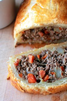 a meat and vegetable pastry cut in half