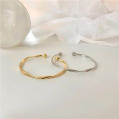 ✦ Our Simple Gold Wave Open Cuff Bangle Bracelet is a dainty and stylish accessory perfect for everyday wear. Crafted from high-quality materials and plated with a shiny gold finish, this bracelet features a unique wave design and an open cuff for comfortable wear. It makes a thoughtful gift for her, best friend or as a couple bracelet. ----------- DETAILS ------------ Diameter: 6.2cm- Size: Adjustable - Color: Gold/ Silver- Materials: Alloy, Gold Plating- SKU: HB637 Minimalist Gold Metal Cuff Bracelet, Minimalist Metal Cuff Bracelets, Trendy Tarnish-resistant Cuff Bangle, Trendy Tarnish-resistant Cuff Bracelet Bangle, Trendy Tarnish Resistant Cuff Bracelet Bangle, Minimalist Metal Cuff Bracelet, Tarnish Resistant, Adjustable Gold Bangle With A Modern Twist, Minimalist Metal Bangle Tarnish Resistant, Trendy Gold Cuff Bangle