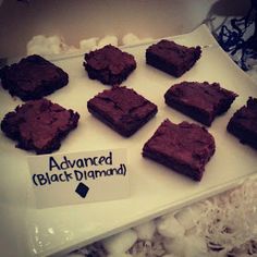 there are many brownies on the plate that have been cut into squares and labeled skithemed party ideas part 1