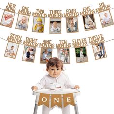 a baby sitting in a high chair holding a cup