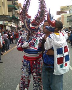 two people in costume standing on the street