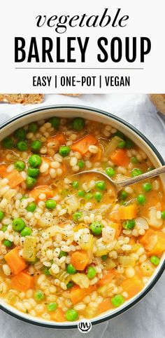 a bowl of barley soup with peas and carrots