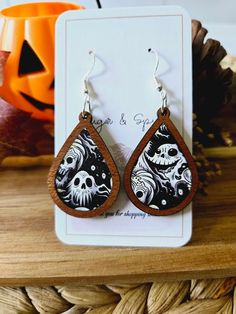 It's spooky season! Put a little fright in your night with these Halloween Acrylic Earrings! Crafted from acrylic and featuring a retro aesthetic, these earrings will give your ensemble a ghoulish touch. Slip into something spooky and accessory with these fabulously frightening earrings! Silver Earring Hooks Ghosts pattern is different on each side! Cherry Wood Inlay They are lightweight and easy to wear. CARING FOR YOUR JEWELRY: * Please remove earrings before bathing and swimming. Material: Hypoallergenic Earring Hooks. Nickel-free with anti-allergy can be used for sensitive skin REFUNDS/EXCHANGES We cannot offer exchanges on earrings due to sanitary conditions of wearing in earlobe. If you item is damaged during shipping, we will be happy to replace your item! Please provide an image of Spooky Pierced Earrings For Halloween, Spooky Halloween Ear Wire Earrings, Halloween Spooky Ear Wire Earrings, Spooky Halloween Drop Earrings, Spooky Dangle Earrings, Fun Halloween Dangle Earrings, Halloween Acrylic, Unique Dangle Earrings, Spooky Black