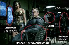 a man sitting in a chair next to a woman on the set of batman v superman movie