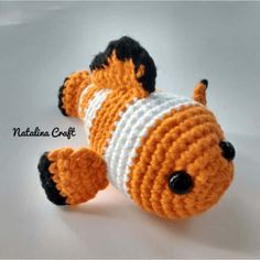 a crocheted stuffed animal is laying down