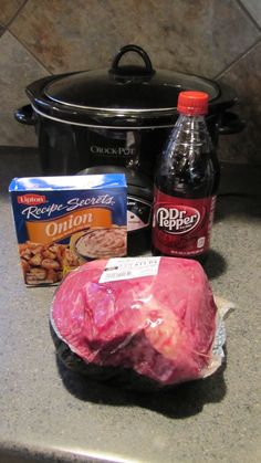 ingredients for slow cooker pork roast sitting on the kitchen counter next to an open crock pot