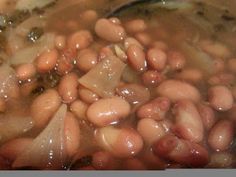 some beans are being cooked in a pot