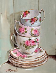 a stack of tea cups and saucers on top of each other with pink flowers