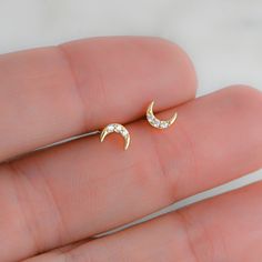 Tiny moon stud earrings! Perfect for a minimalist or for stacking! - - - D E T A I L S - - - * Made of 925 Sterling Silver * We use a THICK, DURABLE plating of 14K Gold, Rose Gold or Rhodium - for a piece that will last you years to come! * Highest Grade CZ for an authentic diamond look! * Nickel-free & Hypoallergenic * Length: 5.4mm ♥︎ ♥︎ ♥︎ Model Details ♥︎ ♥︎ ♥︎ 2nd Hole- https://www.etsy.com/listing/1154500077/tiny-ball-stud-earrings-ball-studs-stud?click_key=772e6d7f7021c5b7e72d2c2498531b61 Moon Shaped Cartilage Earring As Gift, Moon Shaped Cartilage Earring For Gift, Moon Shaped Single Cartilage Earring As Gift, Gift Moon Shaped Single Cartilage Earring, Dainty Crescent Cartilage Earrings As Gift, Gift Moon Cartilage Earrings, Gift Moon-shaped Cartilage Earrings, Half Moon Single Earring As A Gift, Half Moon Earrings For Pierced Ears As Gift