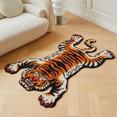 a tiger rug is on the floor next to a chair