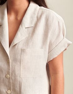 Comfortable, a little bit rugged, yet effortlessly elegant. It's what you'll reach for again and again.[show_more]The Studio Shirt is the indispensable, short-sleeve warm weather essential. Cut in 100% linen which wicks away moisture to keep you dry, this button-up comes equipped with a relaxed, notched lapel, useful breast pocket, a tuckable (or not!) sculpted split hem that ends in our signature butt swoop. Fastened with troca shell buttons, the Studio Shirt is ready to be your elevated everyd Beige Johnny Collar Shirt With Relaxed Fit, Linen Shirt With Johnny Collar And Pockets, Relaxed Fit Linen Short Sleeve Shirt With Rolled Sleeves, Collared Linen Tops With Welt Pockets, Unstructured Linen Tops With Lapel Collar, Linen Collared Short Sleeve Shirt With Placket, Everyday Linen Short Sleeve Button-up Shirt, Short Sleeve Linen Shirt With Spread Collar, Linen Short Sleeve Shirt With Spread Collar