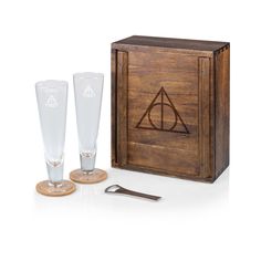 a wooden box with two glasses and a bottle opener