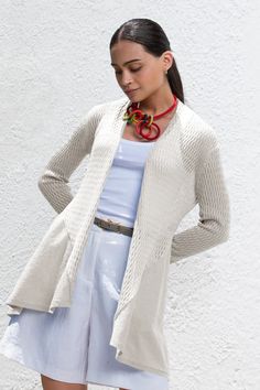 This 100% organic cotton cardigan boasts a classic ribbed texture that will add depth and sophistication to your outfit. Designed with versatility in mind, it features an open front for effortless layering. The long sleeves provide cozy coverage while maintaining sleek lines that complement your silhouette. Falling gracefully to mid-thigh, this piece offers both warmth and style without compromising on movement or ease. Open front Long ribbed texture sleeves Lightweight & Comfortable Hypoallerge Layering Fine Knit Outerwear, Long Sleeve Ribbed Sweater Coat For Layering, Versatile Open Front Sweater For Layering, Versatile Layering Cardigan, Ribbed Cardigan For Fall Layering, Spring Cable Knit Cardigan For Everyday, Fall Ribbed Cardigan For Layering, Spring Fitted Cable Knit Sweater Coat, Classic Textured Knit Outerwear For Spring