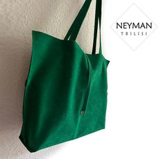 This bright emerald green bag is made from a very high quality artificial vegan suede leather  and is comfortable for every day use. Its simple design makes it perfect for any and every occasion like work, shopping, going out etc. The bag is lightweight. It has a medium size inner pocket that is perfect for quick access to your necessities. The handles are designed for a perfect fit for your shoulders. The bag has stylish metal accessory as a decoration. Every bag is made especially for you, so Green Suede Bags For Everyday Use, Green Suede Shoulder Bag For Everyday Use, Oversized Beach Bags, Leather Shopper Bag, Slouch Bags, Large Leather Tote Bag, Fabric Purses, Oversized Bag, Large Leather Tote