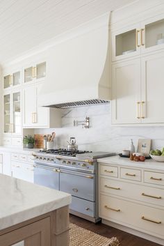 the instagram page on instagram com shows an image of a kitchen with white cabinets and