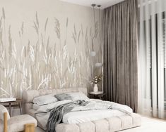 a bedroom with a bed, chair and wallpaper on the walls is decorated in neutral tones