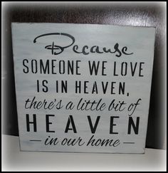 a sign that says because someone we love is in heaven there's a little bit of heaven in our home