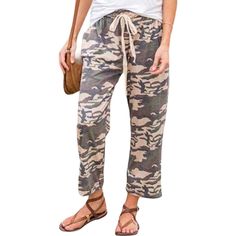 The Amaryllis Women's Camo Print Drawstring Cropped Pants are the perfect blend of style and comfort. Featuring a trendy camouflage print, these pants offer a casual yet chic look that is ideal for everyday wear. The drawstring waist allows for a customizable and secure fit, while the relaxed fit and cropped length provide ease of movement and a laid-back vibe. Made from high-quality, breathable fabric, these pants are designed to keep you comfortable throughout the day. Whether you're running e Camo Print Pants, Wide Leg Lounge Pants, Womens Camo, Camouflage Print, Printed Drawstring, Womens Fleece, Bottom Clothes, Printed Pants, Camo Print