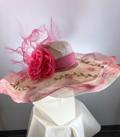 This ivory, pink and green women's straw hat is so pretty! It is completely handmade, hand blocked and one of a kind. The hat is topped with a sinamay straw brim that I tinted then embellished with a leafy vine. It's further embellished with a peachy pink silk band, handmade silk flower and wispy distressed crinoline. It is perfect for a special occasion like Kentucky Derby, Kentucky Oaks, church or summer garden party. The Wide brim makes a statement, as does the slightly asymmetrical crown. A Handmade Straw Hat For Summer Garden Party, Handmade Straw Hat For Garden Party In Summer, Handmade Whimsical Sun Hat For Summer, Whimsical Handmade Straw Hat For Summer, Bohemian Pink Sun Hat For Garden Party, Pink Bohemian Sun Hat For Garden Party, Handmade Summer Party Straw Hat, Handmade Wide Brim Straw Hat For Kentucky Derby, Handmade Wide Brim Sun Hat For Garden Party