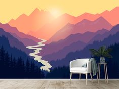 a room with a mountain scene wallpaper and a chair in front of the window