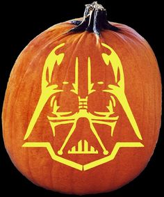 a pumpkin with a darth vader face on it