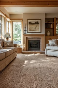 a living room with two couches and a fire place in the middle of it