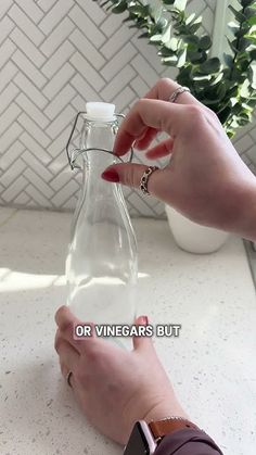 a person is holding a bottle with some liquid in it and the words, or vinegars but