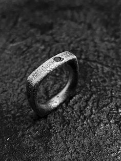 Minimalist roughness. Raw, pure and edgy surfaces with a strong and grunge look & feel. A fully handmade process make every piece unique, no ring will have the same texture. Forged with sand and fire, your ring will reflect your unique souls. A black zirconia stone is encrusted on the ring as symbol of strength. Dare to wear it, dare to be you.MATERIALS:Textured, oxidized and heavy brushed 925 sterling silver .Black cubic zirconia stone.Each piece is made and finished by hand, for this reason ev Grunge Rings Men, Rough Rings, Forged Ring, Brutalist Ring, Grunge Ring, Brutalist Jewelry, Russian Roulette, Rough Jewelry, Symbol Of Strength