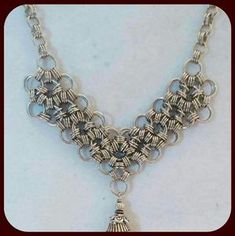 Shop Women's Handcrafted Silver Size 22 inches Necklaces at a discounted price at Poshmark. Description: Japanese style chain maille silver necklace. The center of the chain maille pattern has a silver chain tassel. All is attached to a handcrafted silver linked chain. Has a lobster claw clasp. Necklace is 22 inches long. Necklace is new and created and crafted by me.. Sold by moorelaura. Fast delivery, full service customer support. Handmade Silver Dangle Chain Necklace, Chainmaille Jewelry Patterns, Chain Maille Patterns, Chainmaille Jewelry, Silver Link Chain, Chain Maille Jewelry, Chain Maille, Clasp Necklace, Create And Craft