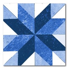 a blue and white patchwork quilt design