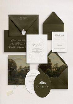 an assortment of wedding stationery and envelopes