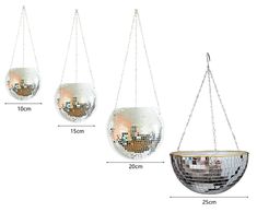 three hanging disco balls with chains attached to the bottom, one is filled with mirrors