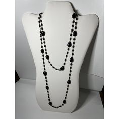 This is part of Chairish’s Costume Jewelry assortment.  A versatile opera chain necklace from the 1920s. I believe this to be black lacquer over ceramic beads. It’s shiny and glossy and linked with gold wire. Can be worn double or tied as shown. Or just long with a flapper dress. It’s all one over the head piece with no clasp. If it did open up it would be 48” long as it hand “24. Black Single Strand Necklace For Party, Elegant Black Beaded Chain Necklace, Party Black Single Strand Beaded Necklace, Black Single Strand Beaded Necklace For Party, Black Single Strand Beaded Necklaces For Party, Party Long Necklace With Black Beads, Vintage Black Chain Necklace For Party, Classic Black Necklace For Party, Double Strand Beaded Chain Necklace For Party