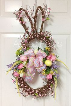 an easter wreath hanging on the front door