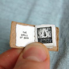 a miniature piece of bread with the word smell of rain printed on it