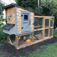 a chicken coop with a star on the roof