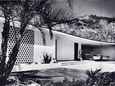 a black and white photo of a modern house