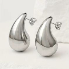 18kgp Stainless Steel Chunky Waterdrop Earrings Silver Or Gold. Hypoallergenic. Won't Chip, Tarnish Or Fade. Great For Sensitive Ears. Beautiful Statement Studs. I Accept Reasonable Offers And Discount Bundles!! Check Out My Other Listings And Follow Me!! I Have Over 4500 Listings And I Offer Buy2 Get 3rd Free Or 30% Off 5+ Items At Poshmark.Com/Closet/Pepepizzazz On Posh App, Use My Invite Code "Pepepizzazz" For Extra $10 Coupon Silver Drop Jewelry With Shiny Finish, Metal Drop Jewelry With Shiny Finish, Gift Shiny Finish Teardrop Earrings, Silver Drop Earrings Minimalist Style, Silver Drop Earrings With Shiny Finish, Modern Silver Teardrop Earrings Tarnish Resistant, Elegant Silver Water Drop Earrings, Metal Jewelry With Shiny Teardrop Finish, Trendy Silver Teardrop Metal Earrings