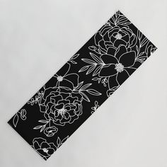 a black and white floral design on a piece of paper that has been cut out