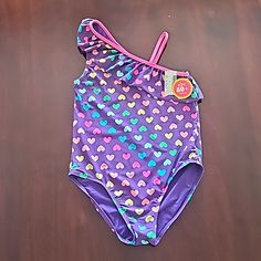 Nwt - The Children's Place Girl's Bathing Suit. Purple With Colorful Hearts (Multi Color), Sz L (10/12) Playful Purple Fitted Swimwear, Playful Fitted Purple Swimwear, Playful Purple Swimwear, Suit Purple, Colorful Hearts, Bath Girls, Kids Swimming, Graduation Cap, Colorful Heart