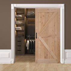 an open wooden door to a walk in closet