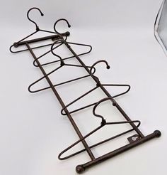 a metal rack with clothes hanging on it