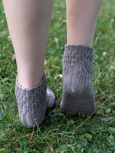 This sleek, top-down sock in five sizes (XS/S/M/L/XL) is dazzlngly simple to knit, yet is super-stylish paired with anything from shorts to dress trousers. PLUS, it's reversible if you like a doubled cuff! With a modern take on ribbing from top cuff to ankle, it can be worked tall or short to suit its purpose and in a variety of fiber choices. Shown here: ankle sock in size S knit with Modern Deco Sport in color Carbon Steel; tall sock in size M knit with Modern Deco Sport in color TitaniumSugge