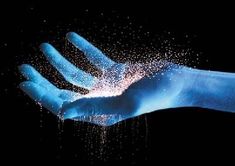 a person's hand is sprinkled with powder