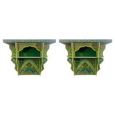 pair of green and yellow painted wooden shelves