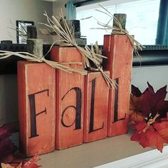 two wooden blocks with the word fall written on them